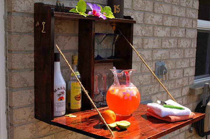 29) Build a hideaway bar for easy outside entertaining
