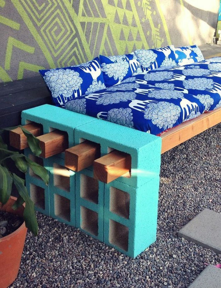 2) Or stack a few cinder blocks and insert wood beams to create an outdoor couch or bench