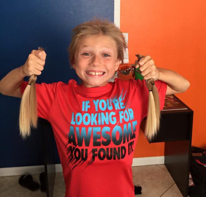 After 2 1/2 years, his parents cut off his hair in 4 10-inch ponytails and donated them to Children With Hair Loss
