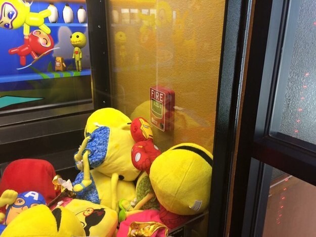 7. Whoever decided to put this fire alarm in a claw machine.