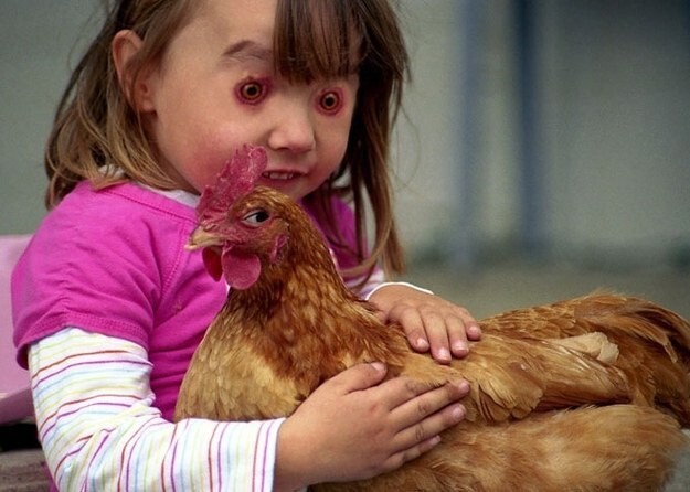 Skeptical Chicken Held By Demon Child