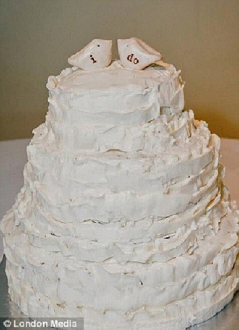 6. Every little girl's dream wedding cake: a pile of white with what look like salt and pepper shakers as toppers.