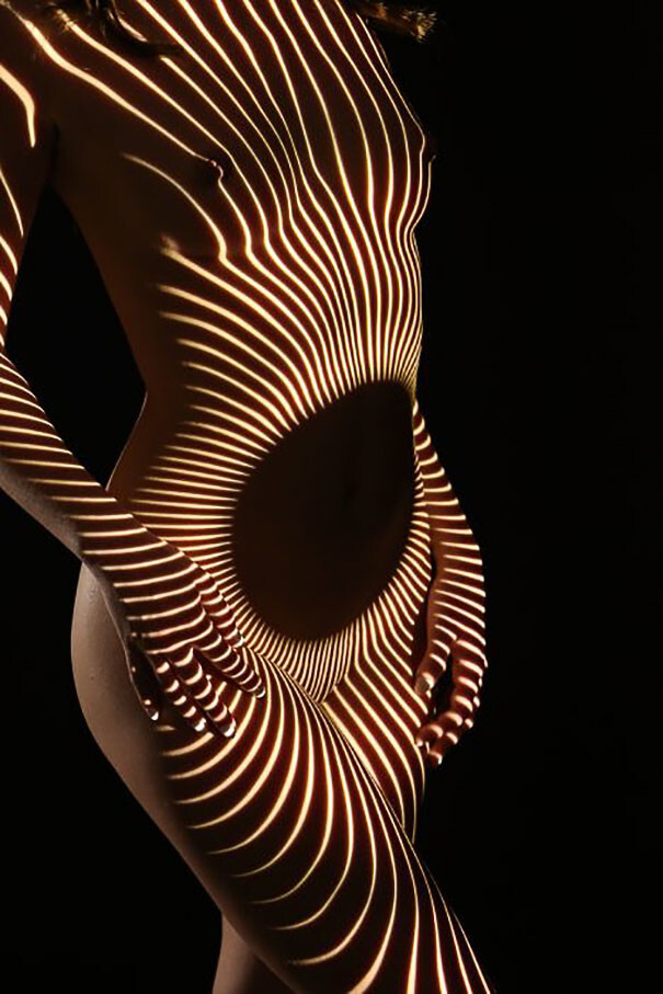 Photographer Dresses Nude Women In Light And Shadows 