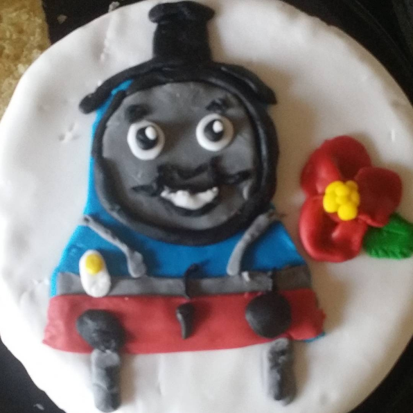 This Thomas the Tank Engine cake made by an untrained baker.