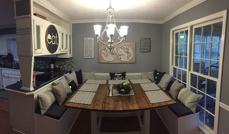 16. A few throw pillows and table setting accents bring the finished project together. This booth can now fit 12 people, and up to 15 if chairs are placed at the end of the table.