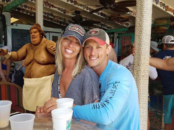 Couple Asks Internet To Photoshop Out Shirtless Guy From Engagement Photo, Regrets It Immediately