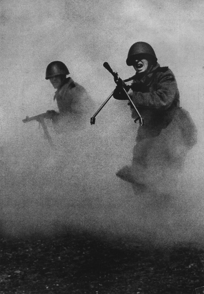 Soviet infantry charge through smoke during the WW2