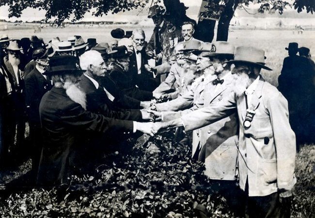 The 1913 Gettysburg reunion of 53,407 American Civil War vetererns of the Battle of Gettysburg’s 50th anniversary shake hands