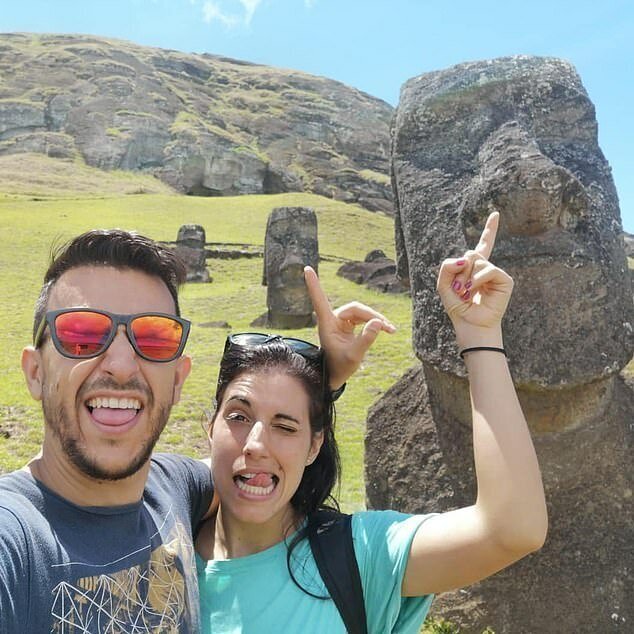 Van Tilburg said many visitors to the island seem more interested in taking selfies picking the statues' noses (above) than learning about its history and culture 