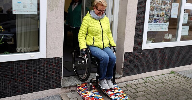 Rita Ebel, nicknamed 'Lego grandma', testing out one of her wheelchair ramps built from donated Lego bricks in Hanau, Germany, on Monday