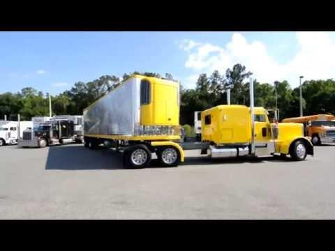 Professional driver jackknifing a 53 foot trailer into a parking space. 