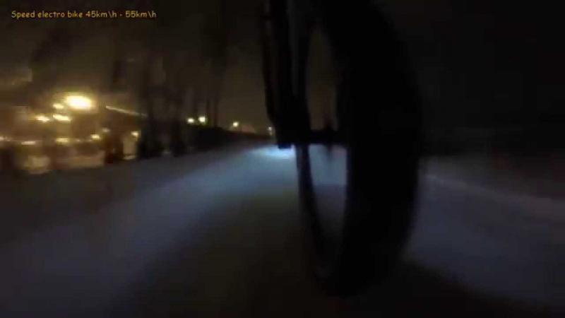 Winter electric bike in russian. Snowy bypass road in Moscow MKAD. 