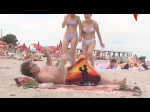 A man makes fun on the beach 