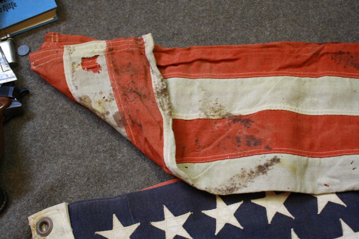 В ней также был найден трофейный американский флаг.На котором была кровь...