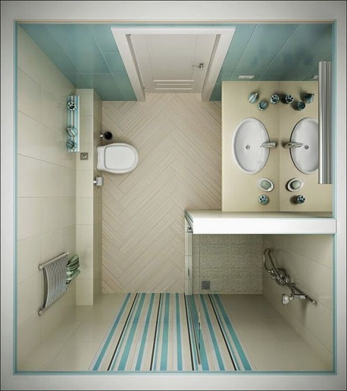 Громоздкую душевую кабину можно заменить на душ в углу комнаты со сливом в полу