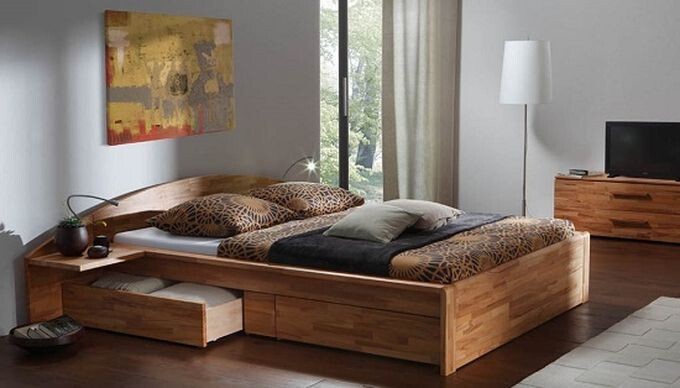 2. Кровать с просторными ящиками, в которых можно хранить подушки, пледы, одеяла