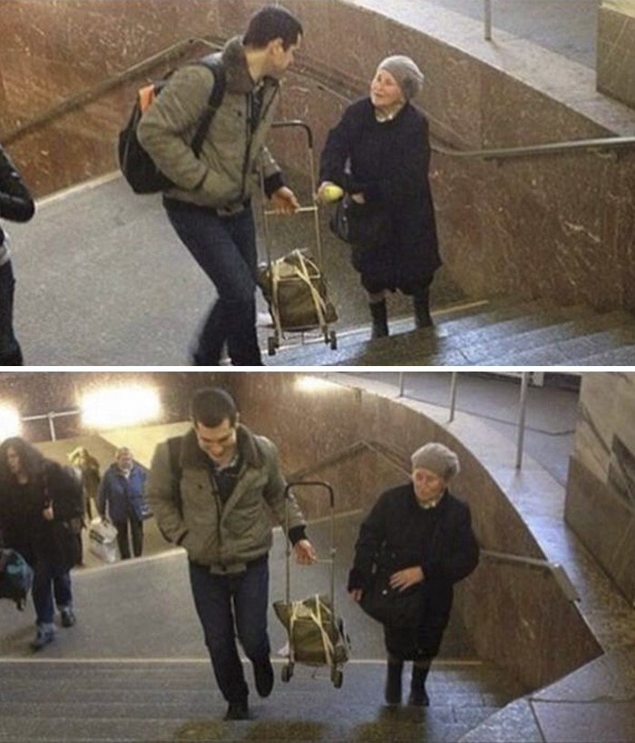 Юноша помогает старушке поднять тележку по лестнице