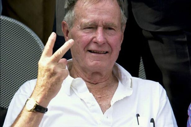 Джордж Буш-ст. и знак V