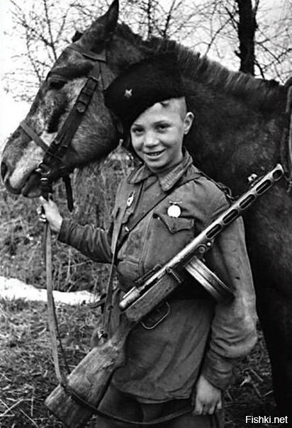 Юный разведчик-кавалерист Витя Поздняков за рейды в тыл врага награжден медал...