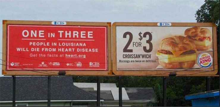 Один из трех человек в луизиане умирает от болезней сердца, и рядом реклама не здорового питания вызывающего эти самые болезни.