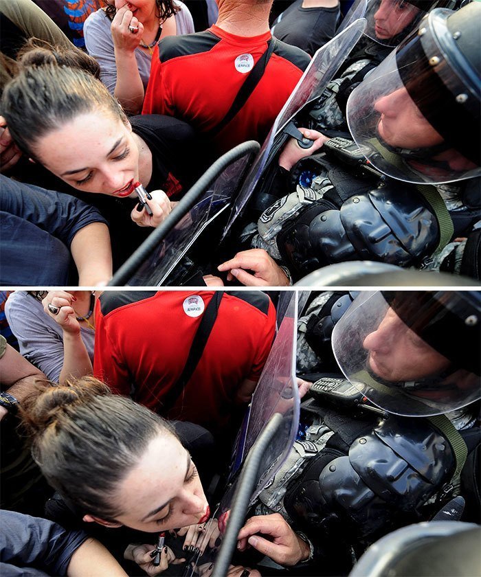 Девушка целует щит полицейского во время антиправительственной демонстрации перед зданием правительства Македонии в Скопье, май 2015