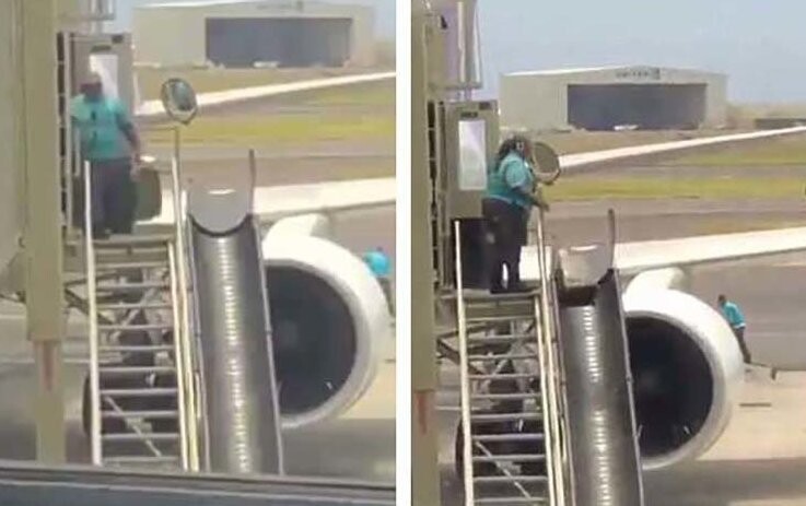 Сотрудник аэропорта в Гонолулу небрежно выгружает багаж из самолёта