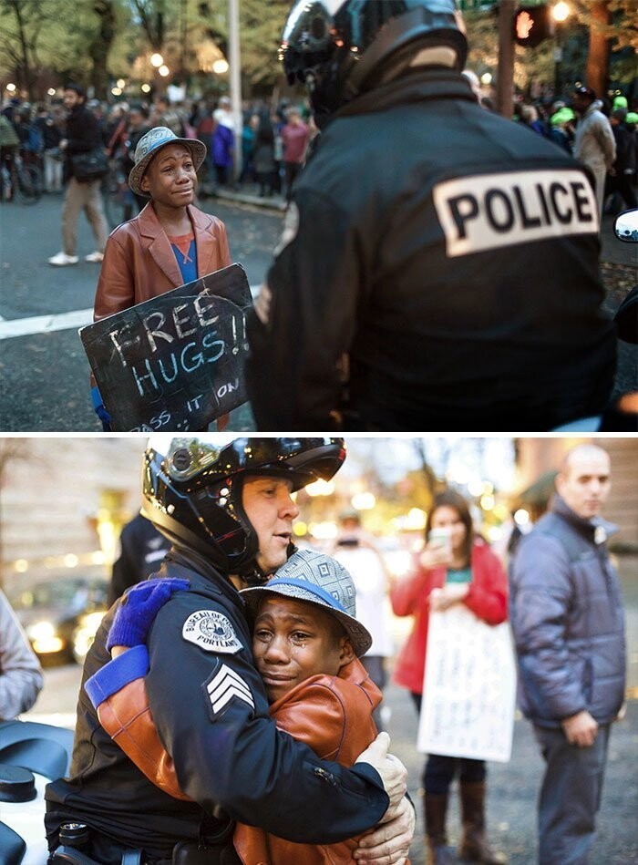 Мальчик обнимает полицейского во время протеста в Портленде