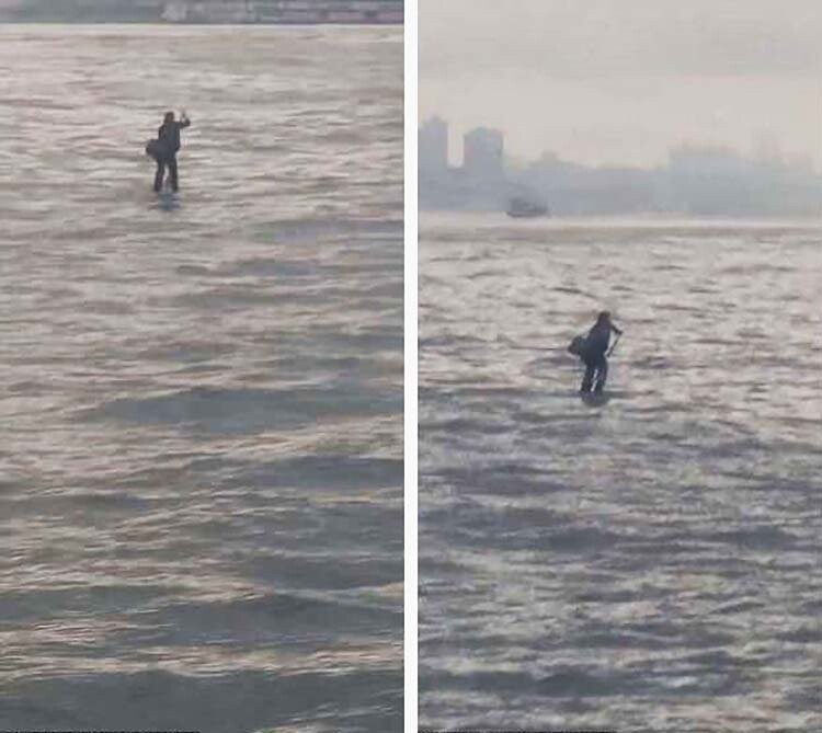 В Нью-Йорке мужчина, опаздывая на встречу, переплыл реку Гудзон на доске для сёрфинга