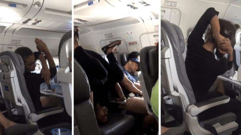 Йогини на борту: женщина занялась йогой в самолете во время рейса