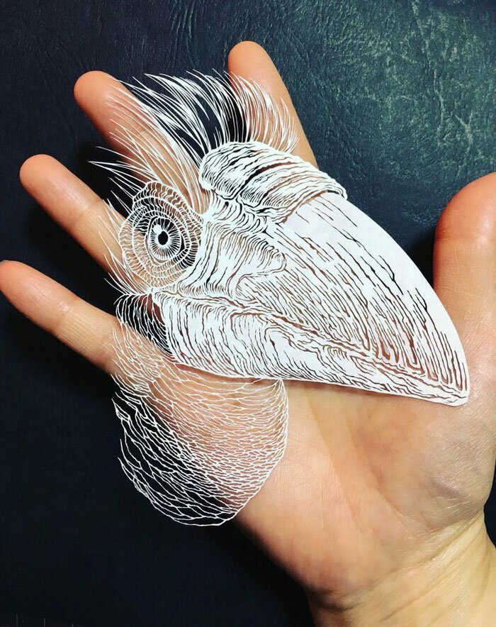 Тонкое японское искусство – осьминог, вырезанный из одного листа бумаги