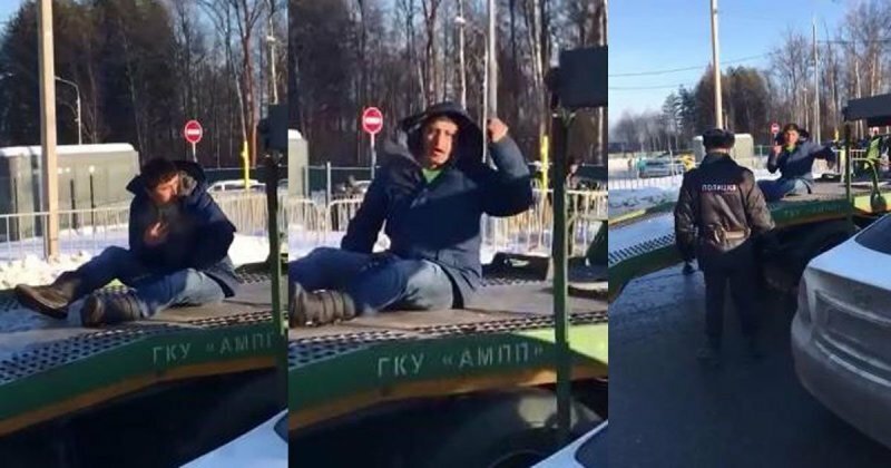 В Москве водитель залез на эвакуатор и не позволял забрать свою машину