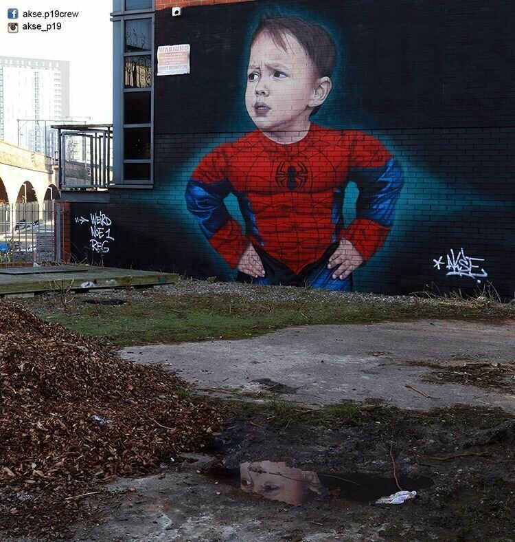 Младший сын художника в образе Человека-паука