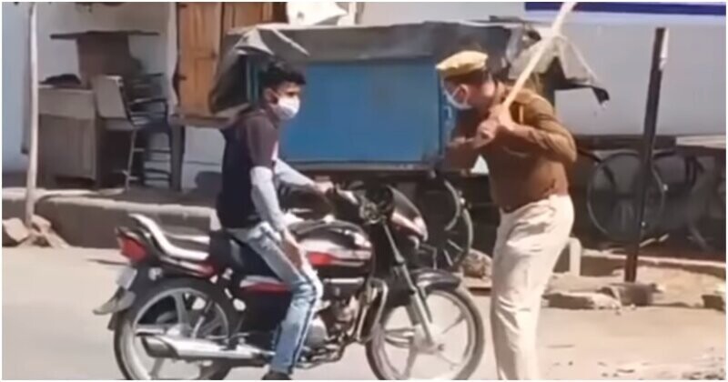 Как индийские полицейские борются с нарушителями карантина