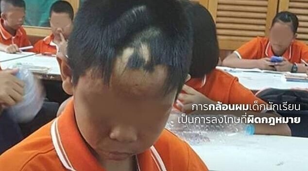 Или вот еще, известное изображение - учитель из провинции Кхонкэн подстриг мальчика, потому что ему не понравилась длина его челки. 