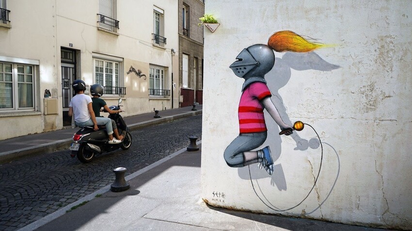 Парижский художник рисует детей на зданиях разных городов