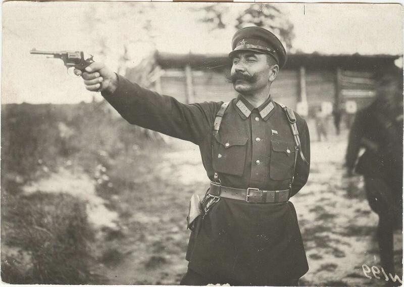 Семен Буденный стреляет из револьвера. 1920-е.