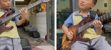 Мальчик великолепно играет на гитаре