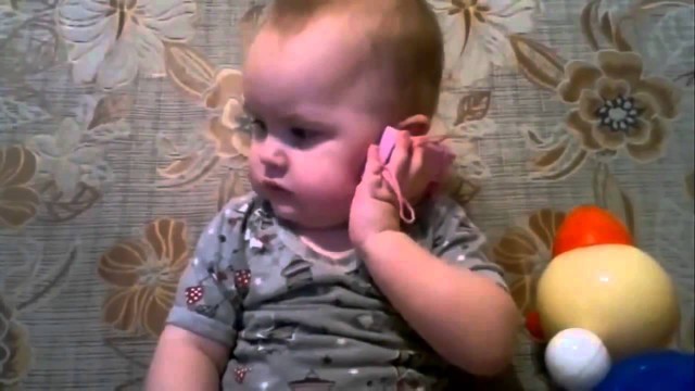 Важный разговор по телефону малыша