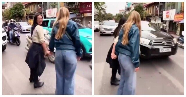 Девушки переходят оживленную дорогу во Вьетнаме