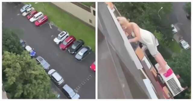 Девушка стоя на кондиционере без страховки мыла окна на 12 этаже